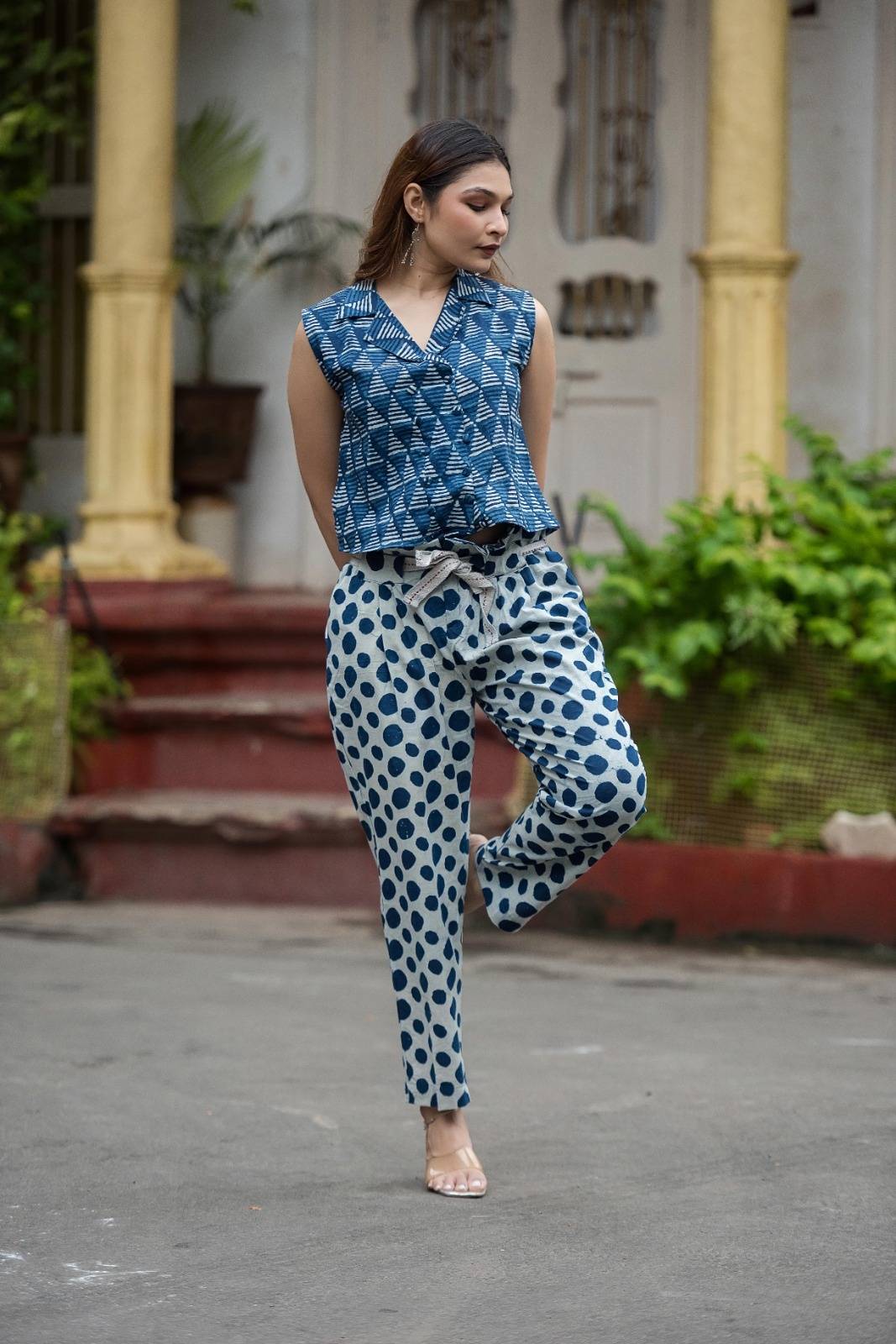 Indigo collared crop top paired with polka dot ankle length pants with belt