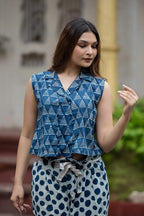 Indigo collared crop top paired with polka dot ankle length pants with belt