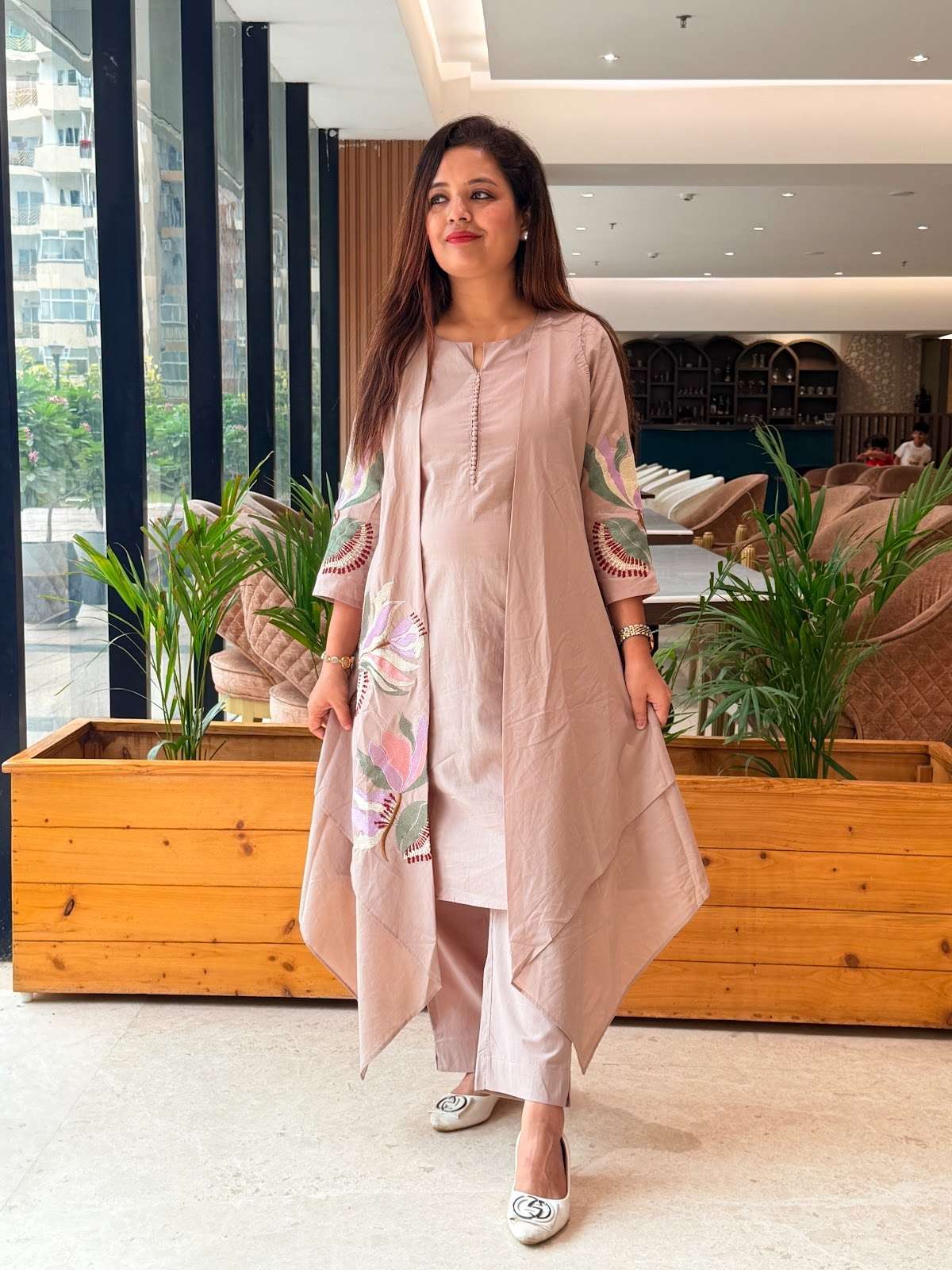 cotton muted grey kurta set featuring an elegant, asymmetrical layered design with delicate floral embroidery on the front panel and sleeves, complete with a button-detail neckline (Copy)