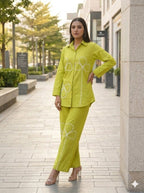 Green Pure cotton co-ord set featuring white appliqué clover or shamrock-style floral details along the front of the tunic and pants