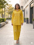 Mustard Yellow Pure cotton co-ord set featuring white appliqué clover or shamrock-style floral details along the front of the tunic and pants