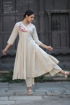 Off white Anarkali  floral-embroidered Angrakha neckline and mirror-work details with bottom