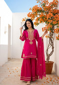 Vibrant pink ethnic sharara set intricate gold zari embroidery
