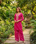 Rani Pink leheriya print georgette co-ord set featuring delicate floral embroidery on the neckline with cotton lining