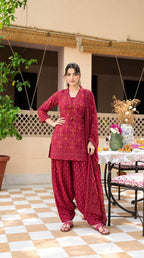 Vibrant maroon bandhani print short kurta set with farshi salwar and a matching printed dupatta